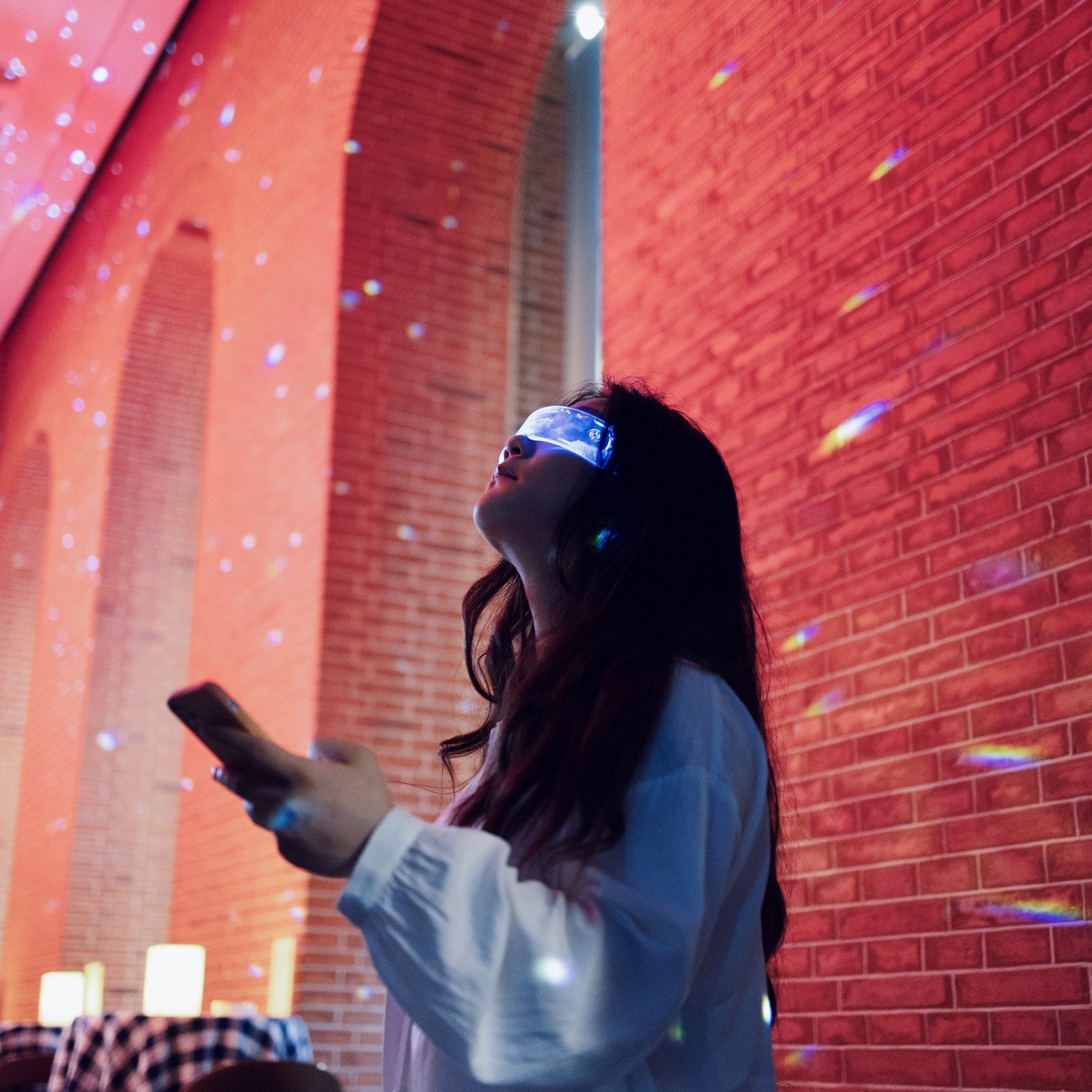 A girl wearing VR glasses